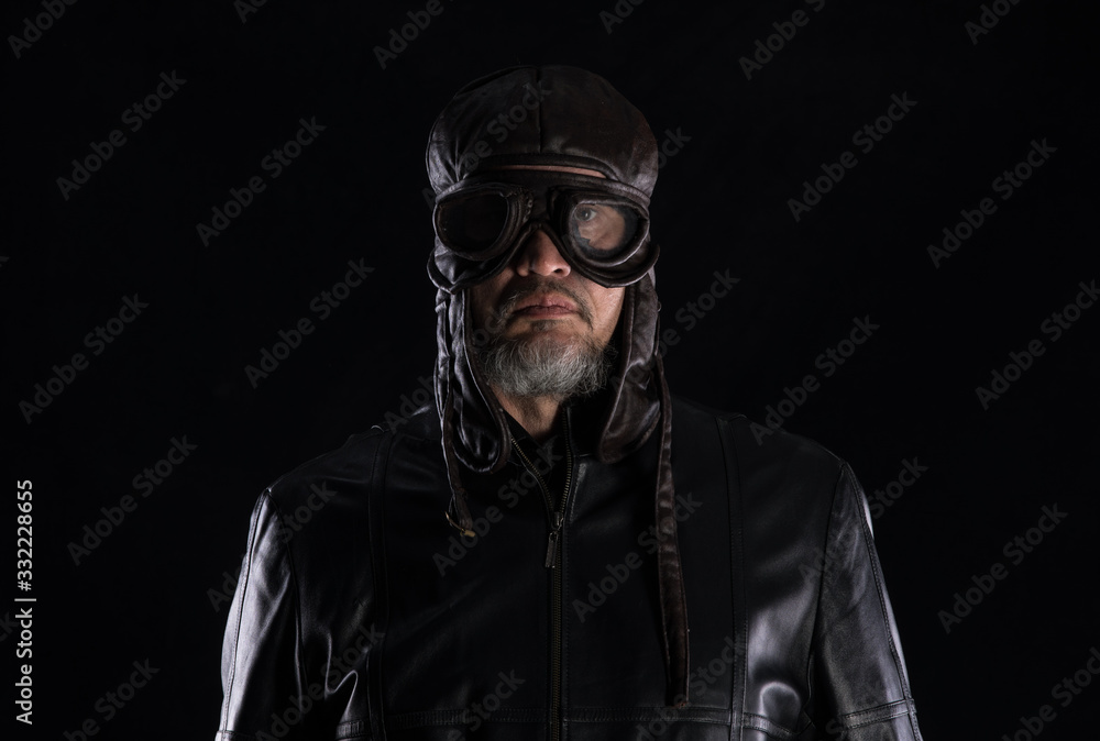 portrait of an old biker on a black background,Chopper motorcycle portrait of an old biker on a black background,Chopper motorcycle