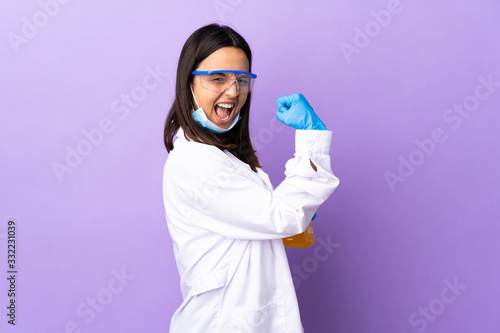 Fototapeta Scientist woman investigating a vaccine to cure coronavirus disease celebrating