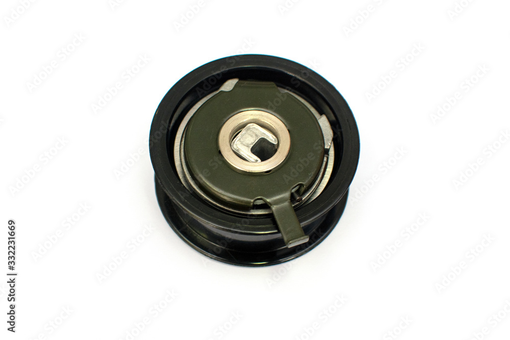 Car belt tensioner isolated on the white background. Spare parts. Car belt tensioner isolated on the white background. Spare parts.