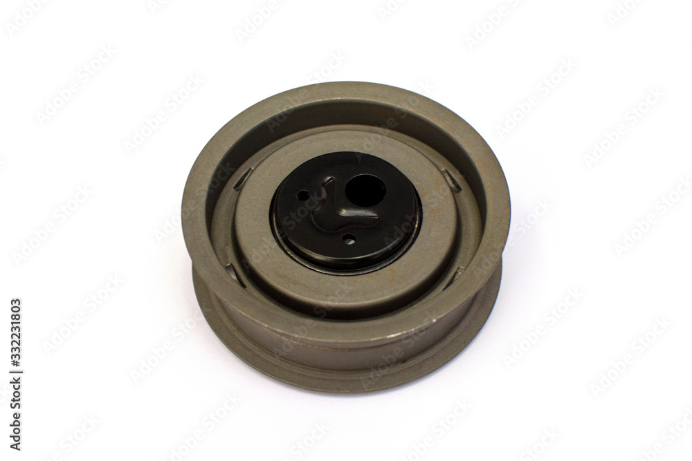 Car belt tensioner isolated on the white background. Spare parts. Car belt tensioner isolated on the white background. Spare parts.