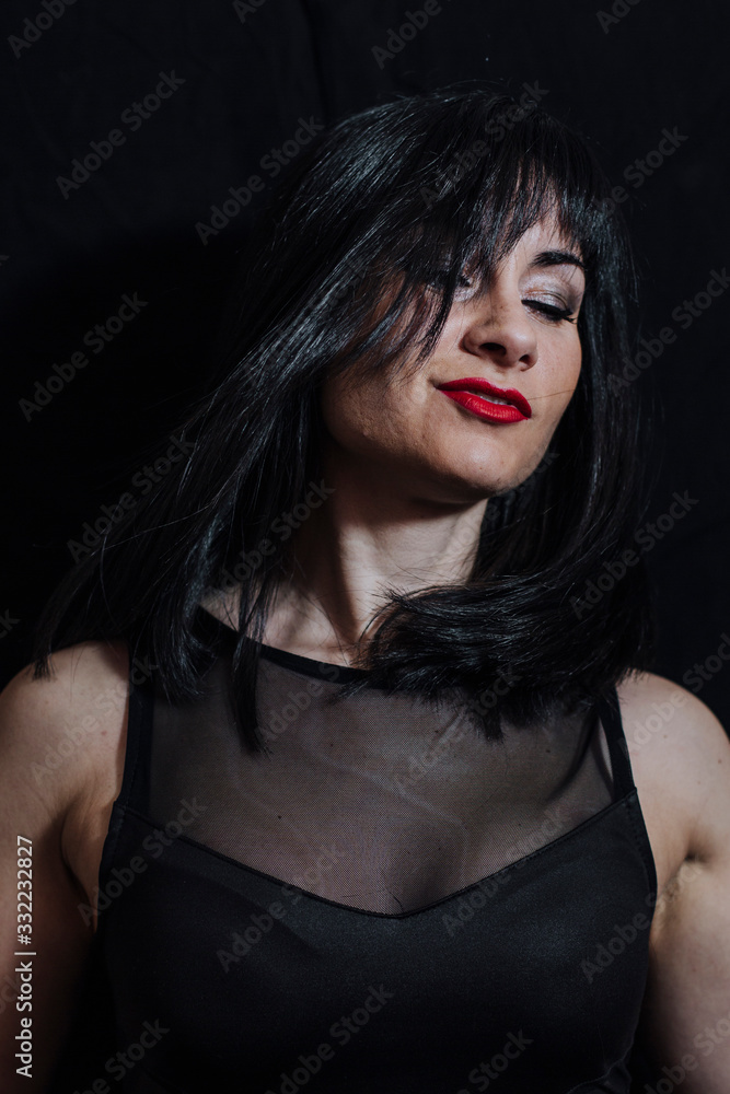 Fototapeta premium woman posing on black background