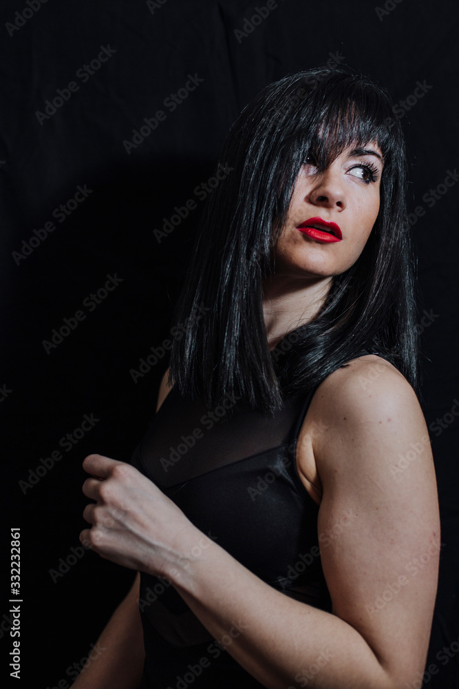 woman posing on black background