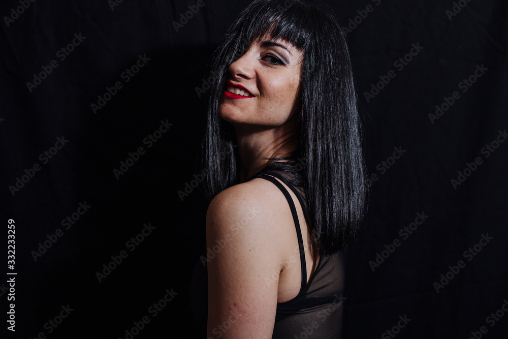 Fototapeta premium woman posing on black background