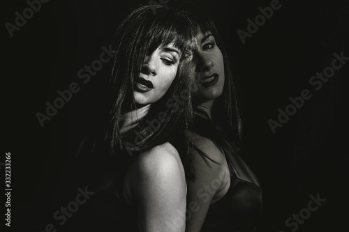 women posing on black background