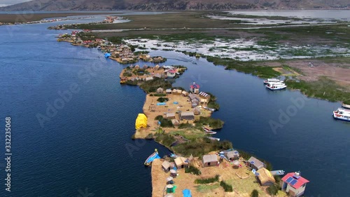 Aerial view of Uros Floating Islands (Spanish: Islas Uros ) on Lake Titicaca, the highest navigable lake in the world, near Puno, Peru, South America.
