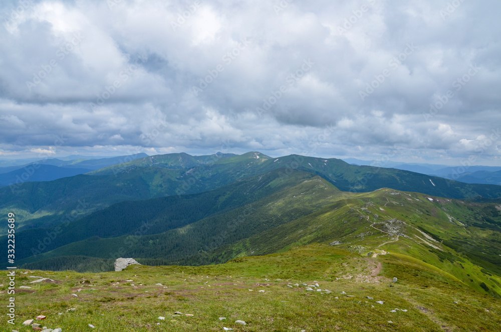Fototapeta premium Beautiful atmospheric view of Chornohora mountains from Mount Pip Ivan. It is the one of the highest mountain of the Ukrainian Carpathian Mountains 