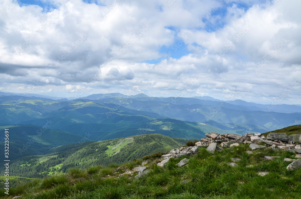 Fototapeta premium Beautiful atmospheric view of Chornohora mountains from Mount Pip Ivan. It is the one of the highest mountain of the Ukrainian Carpathian Mountains 