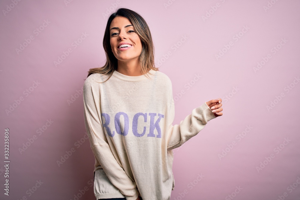 Young beautiful woman wearing fashion urban clothes, model wearing casual street style standing over pink background Young beautiful woman wearing fashion urban clothes, model wearing casual street style standing over pink background