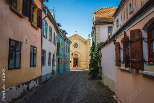 Bastion Street in historic part of Sighisoara city, Romania- view with Cathedral of Saint Joseph