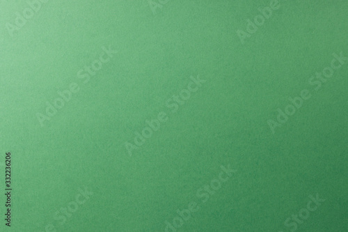 green paper background, copy space, texture.