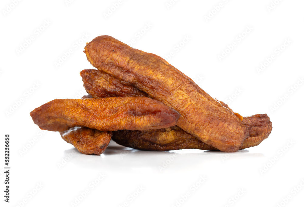 Sun-dried bananas on a white background. Several dried bananas isolated on a white background. Sun-dried bananas on a white background. Several dried bananas isolated on a white background.