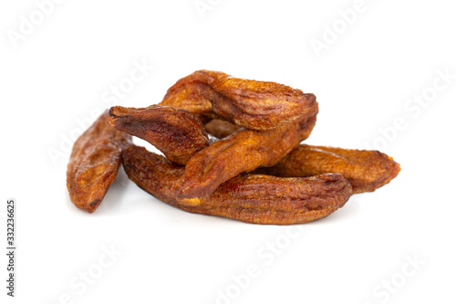 Sun-dried bananas on a white background. Several dried bananas isolated on a white background.