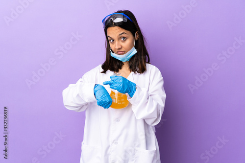 Scientist woman investigating a vaccine to cure coronavirus disease making the gesture of being late