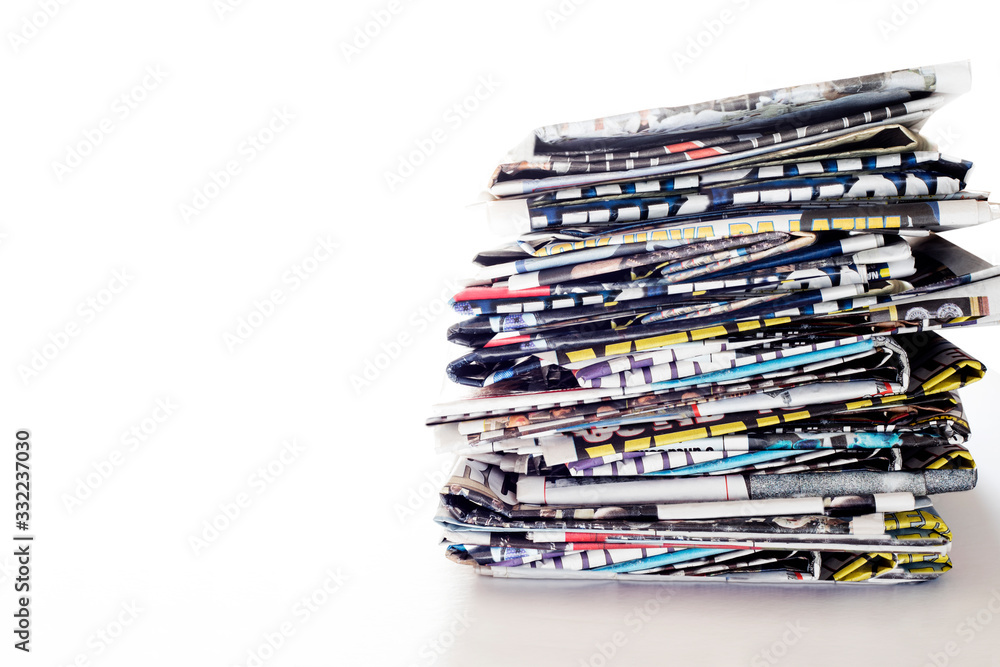 stack of newspapers on white background