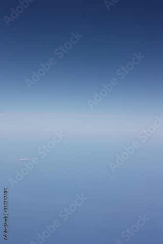 airplane flying over clouds