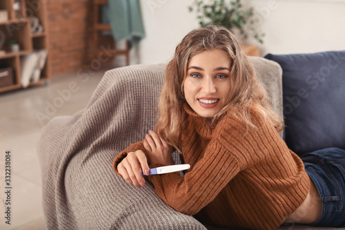 Happy young woman with preg...