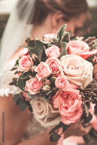 a girl holds a bouquet of flowers