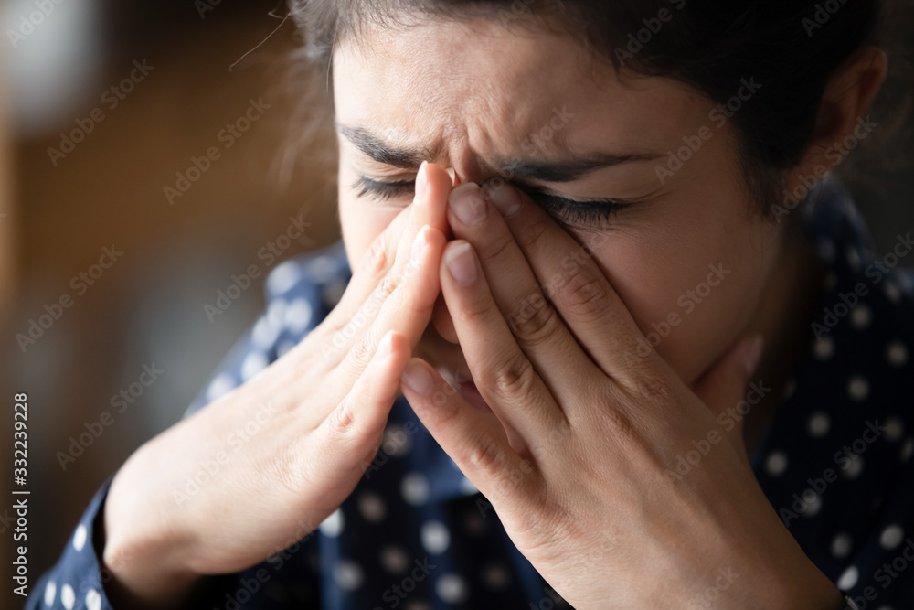 close-up-unhappy-indian-girl-crying-touching-nose-bridge-exhausted