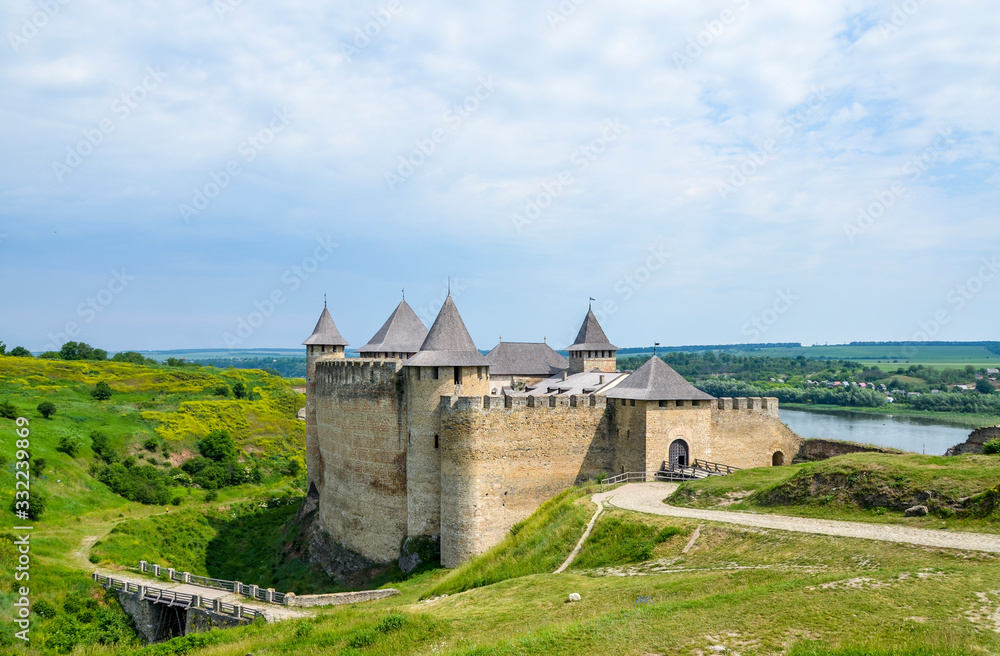 Medieval fortress with towers and defensive walls located on the right bank of the Dniester River in the Khotyn Chernivtsi region, Ukraine. 