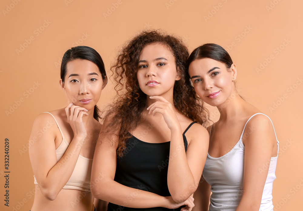Beautiful young women with healthy skin on color background Beautiful young women with healthy skin on color background