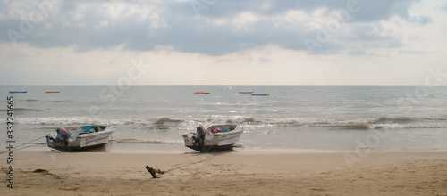 Speed boat parked on the sand beach