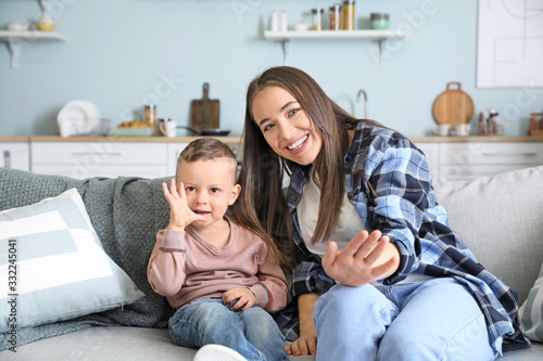 Young mother with son havin...