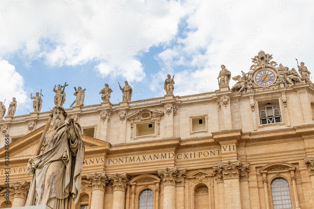 St. Peter's Basilica in Vatican City with the statue of Saint Paul in the foreground.