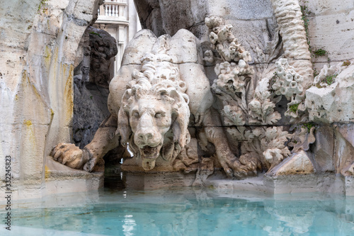 Detail of lion statue at famous Fountain of the Four Rivers. Navona Square in Rome. Italy.  © frank11