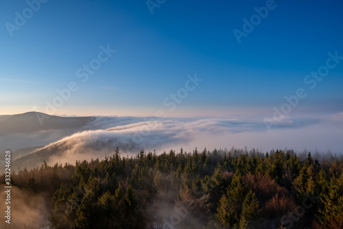 Fototapeta Naklejka Na Ścianę i Meble -  Sunrise in mountains in spring with fog and beautiful forest, Czech Beskydy