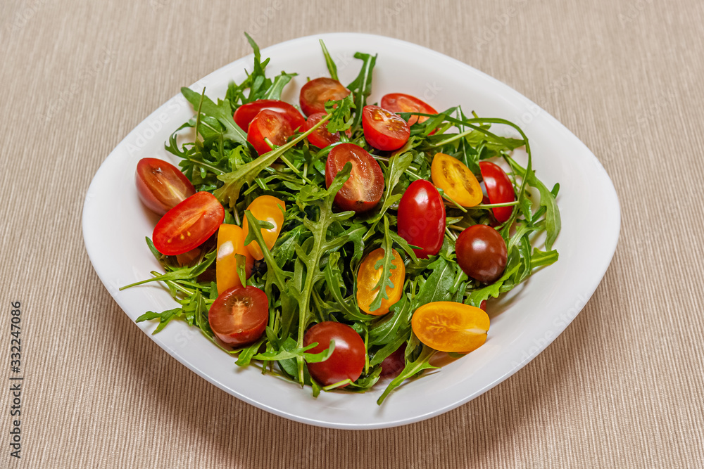 home cooked salad of arugula and cherry tomatoes home cooked salad of arugula and cherry tomatoes