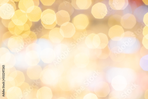 Gold bokeh lights. Abstract glitter festive blur background. Christmas and New Year holidays backdrop