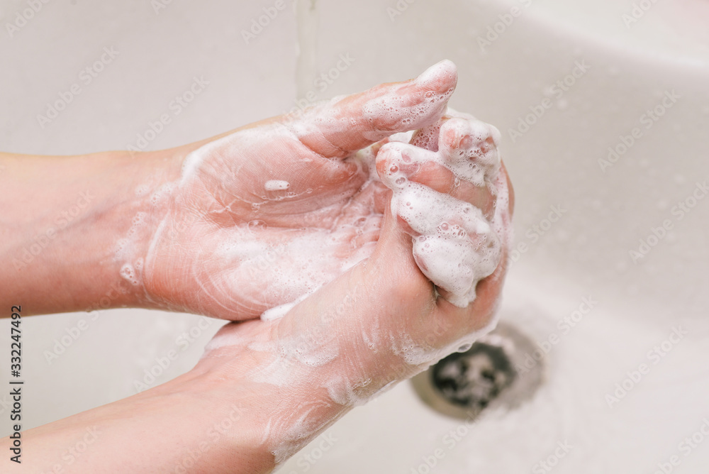 Fototapeta premium Hand washing with soap. Coronavirus epidemic prevention. Influenza Prevention.