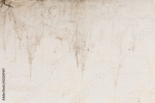 Old weathered and uneven stone wall texture background or backdrop © elenaseiryk