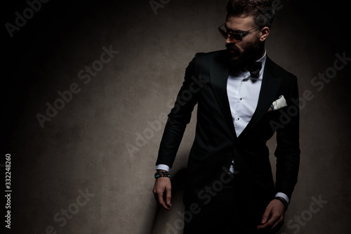 businessman standing and striking a pose with attitude