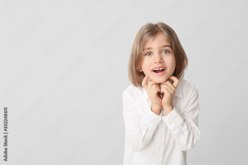 Happy little girl with healthy teeth on light background Happy little girl with healthy teeth on light background