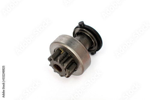 Car starter drive, bendix. Starter detail isolated on white background close-up. Spare parts.