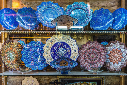 Persian plates for sale on the Grand Bazaar also called Qeysarriyeh or Soltani bazaar in Isfahan city, Iran