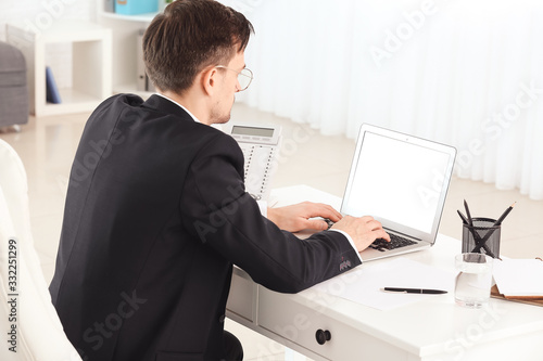 Handsome businessman workin...