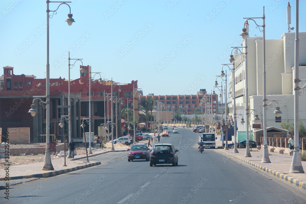 Transportation and traffic on highway in Hurghada city. City with street cars