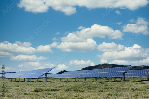 photovoltaic solar power panel on sky background, green clean Alternative power energy concept.