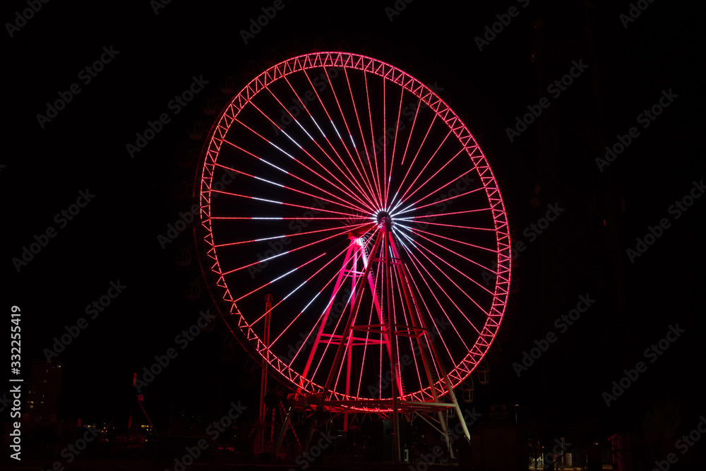 Ferris wheel at night with Turkish flag In Antalya Turkey