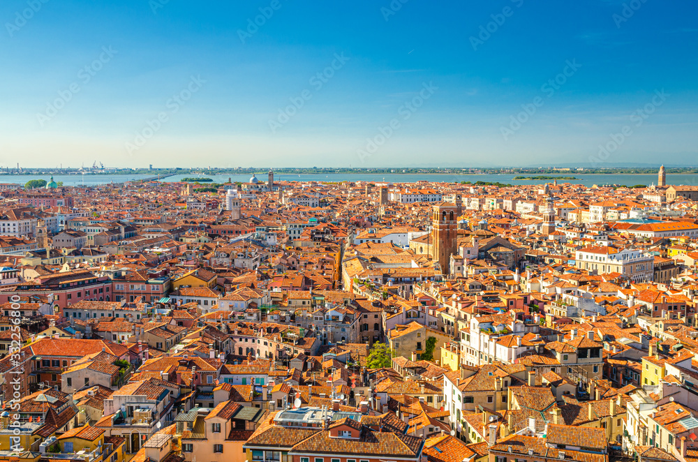 Naklejka premium Aerial panoramic view of Venice city old historical city centre, buildings with red tiled roofs, San Giuliano Mestre and blue sky background, Veneto Region, Northern Italy. Amazing Venice cityscape.