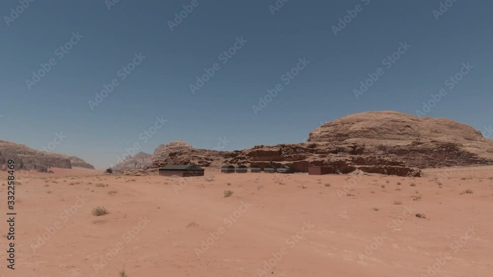 Driving Shot showing a Settlement in the Wadi Rum Desert, Jordan, Middle East Driving Shot showing a Settlement in the Wadi Rum Desert, Jordan, Middle East