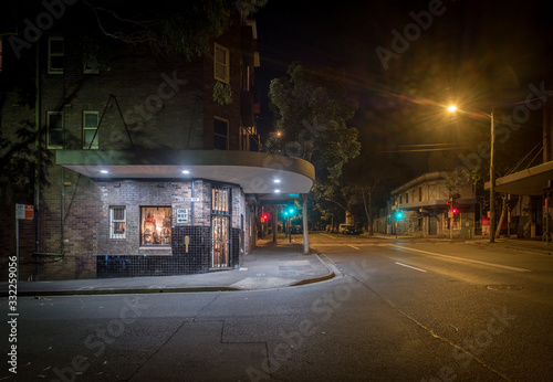 generic old store at night on an empty street