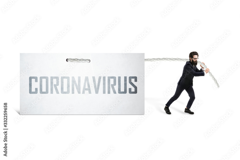 Fototapeta premium Caucasian businessman pulling inscription coronavirus on a white sheet, global virus crisis concept