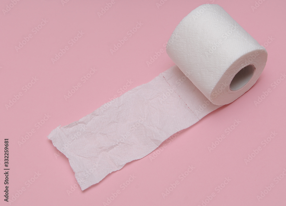 Obraz premium Toilet paper on pink background.