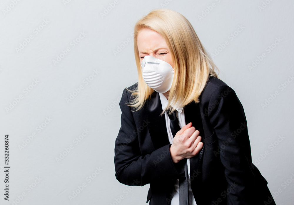desperate businesswoman in black suit and face mask