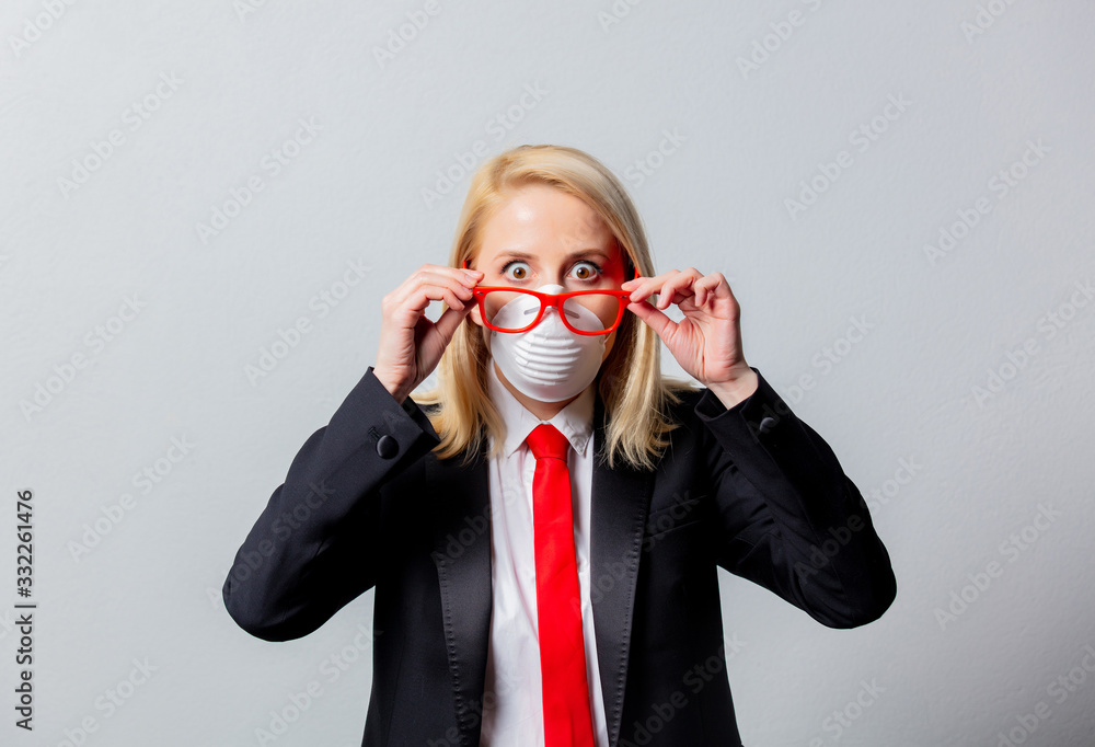 Businesswoman in face mask and red glasses Businesswoman in face mask and red glasses