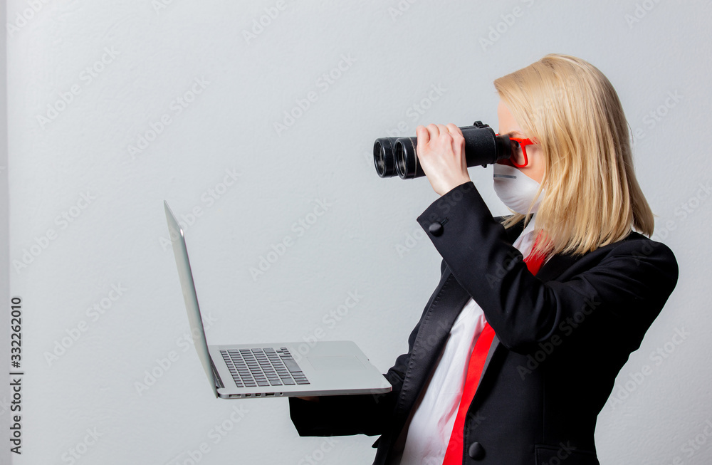Businesswoman in face mask holds binoculars and notebook Businesswoman in face mask holds binoculars and notebook