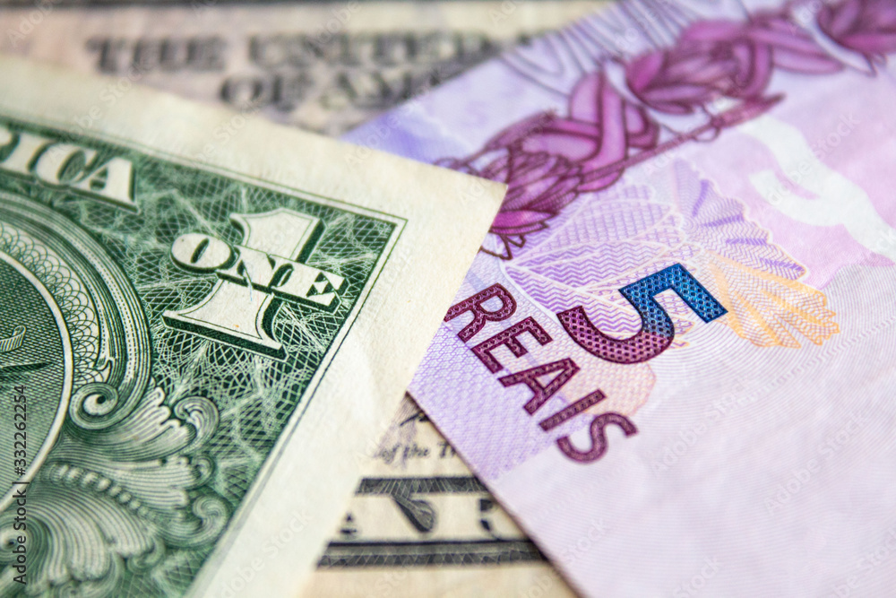 Obraz premium US dollar bill and Brazilian reais banknotes, business finance exchange market